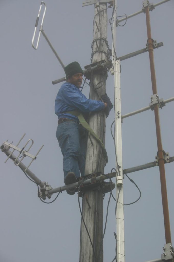 Greg checking the coax feeder and the Antenna.